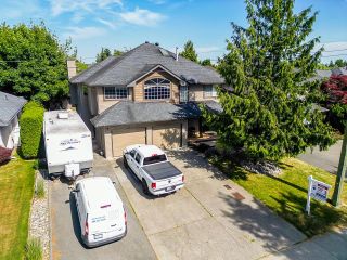 Photo 1: 6130 170 Street in Surrey: Cloverdale BC House for sale in "West Cloverdale" (Cloverdale)  : MLS®# R2784741
