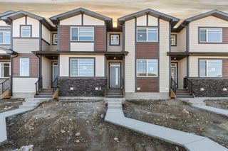 Photo 1: 167 Wolf Creek Avenue SE in Calgary: C-281 Row/Townhouse for sale : MLS®# A2006523