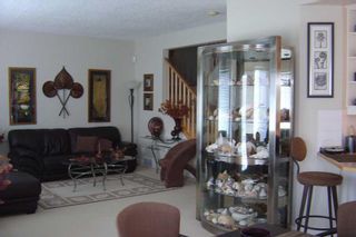 Photo 4: 8 Prominence Park SW in Calgary: Patterson Semi Detached (Half Duplex) for sale : MLS®# A2126879