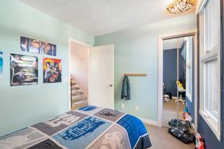 Photo 25: 5 828 Coach Bluff Crescent SW in Calgary: Coach Hill Row/Townhouse for sale : MLS®# A2077646