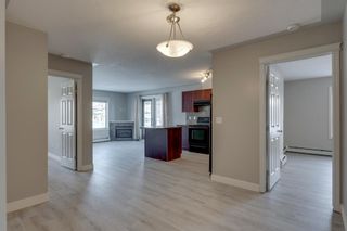 Photo 2: 104 825 Mcdougall Road NE in Calgary: Bridgeland/Riverside Apartment for sale : MLS®# A2014356