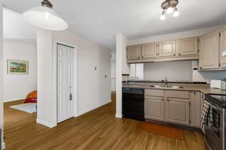 Photo 14: 112 Strathlorne Mews SW in Calgary: Strathcona Park Row/Townhouse for sale : MLS®# A2087332