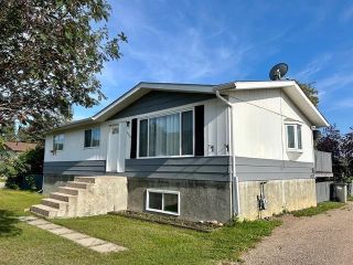 Main Photo: 5524 48 Street in Fort Nelson: Fort Nelson -Town House for sale : MLS®# R2870627