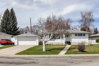 Main Photo: 65 Meadowview Road SW in Calgary: Meadowlark Park Detached for sale : MLS®# A2127138