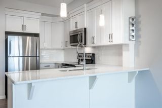 Photo 3: 414 6703 New Brighton Avenue SE in Calgary: New Brighton Apartment for sale : MLS®# A1232876