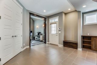 Photo 2: 141 TREMBLANT Heights SW in Calgary: Springbank Hill House for sale : MLS®# C4175148