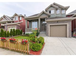 Photo 1: 27754 PULLMAN Avenue in Abbotsford: Aberdeen House for sale in "Station" : MLS®# R2077077
