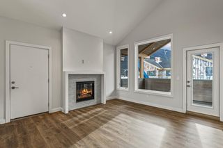 Photo 4: 19 209 Stewart Creek Rise: Canmore Row/Townhouse for sale : MLS®# A2032412
