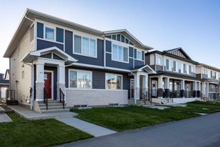 Photo 1: 61 Creekstone Drive SW in Calgary: C-168 Semi Detached (Half Duplex) for sale : MLS®# A2139256