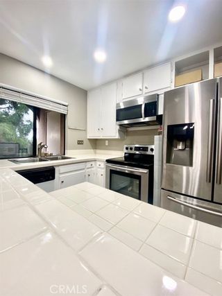 Photo 1: SAN CARLOS Condo for sale : 2 bedrooms : 7855 Cowles Mountain Court #A27 in San Diego