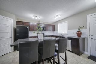 Photo 3: 555 Panatella Boulevard NW in Calgary: Panorama Hills Row/Townhouse for sale : MLS®# A2034434
