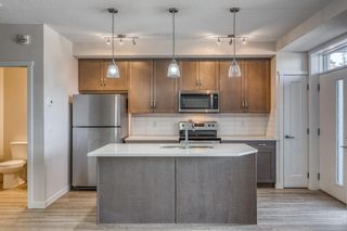Photo 2: 12 30 Shawnee Common SW in Calgary: Shawnee Slopes Apartment for sale : MLS®# A2123625
