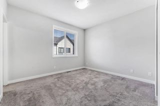 Photo 17: 718 Redstone Crescent NE in Calgary: Redstone Row/Townhouse for sale : MLS®# A2130637