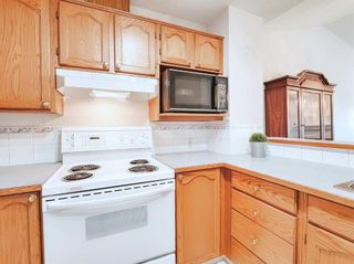 Photo 5: 112 Catalina Circle NE in Calgary: Monterey Park Row/Townhouse for sale : MLS®# A2078124