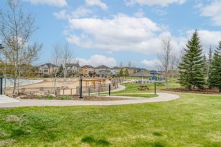 Photo 33: 42 Crystal Shores Cove: Okotoks Row/Townhouse for sale : MLS®# A1218306