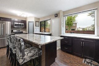 Photo 4: 12 Ranchlands Place NW in Calgary: Ranchlands Row/Townhouse for sale : MLS®# A2054640