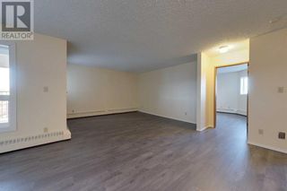 Photo 1: 301, 205 12 Ave  SW in Slave Lake: Condo for sale : MLS®# A2093942