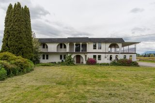 Photo 1: 18621 FORD Road in Pitt Meadows: West Meadows House for sale : MLS®# R2697128