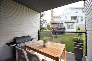 Photo 7: 205 Coachway Lane SW in Calgary: Coach Hill Row/Townhouse for sale : MLS®# A2142572