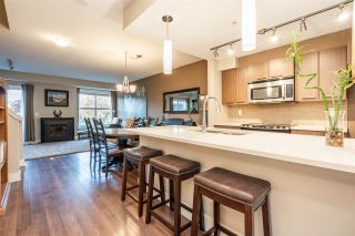 Photo 2: 205 2110 ROWLAND Street in Port Coquitlam: Central Pt Coquitlam Townhouse for sale in "AVIVA ON THE PARK" : MLS®# R2521189