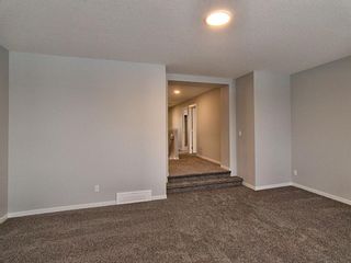 Photo 14: 62 Creekside Avenue SW in Calgary: C-168 Detached for sale : MLS®# A1178097