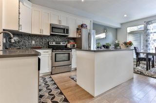 Photo 1: 38 12775 63 Avenue in Surrey: Panorama Ridge Townhouse for sale in "Enclave" : MLS®# R2470117