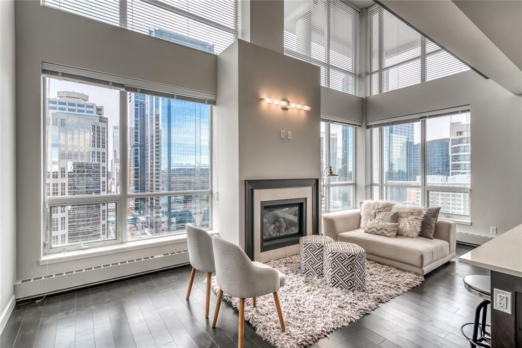 Main Photo: 2027 222 RIVERFRONT Avenue SW in Calgary: Chinatown Apartment for sale : MLS®# A2075884