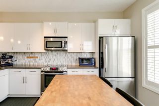 Photo 10: 304 Ascot Circle SW in Calgary: Aspen Woods Row/Townhouse for sale : MLS®# A1217542