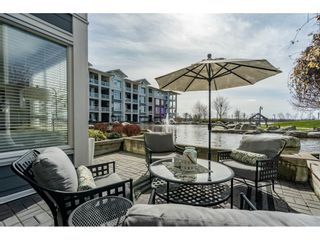 Photo 1: Waterfront Steveston Condo with Water Views and Private Lagoon in Fantastic Well Run Copper Sky