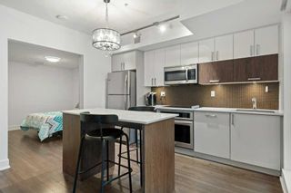 Photo 6: 120 619 Confluence Way SE in Calgary: Downtown East Village Apartment for sale : MLS®# A2114124