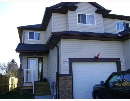 Main Photo: 15 Parklane Drive: Strathmore Residential Attached for sale : MLS®# C3376415