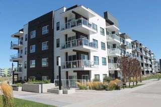 Photo 1: 207 4250 Seton Drive SE in Calgary: Seton Apartment for sale : MLS®# A2002957