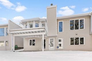 Photo 2: 1038 Shawnee Road SW in Calgary: Shawnee Slopes Semi Detached (Half Duplex) for sale : MLS®# A2113587