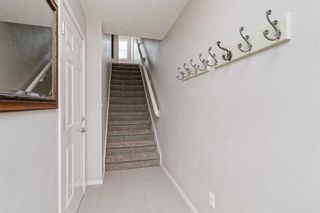 Photo 3: 229 Ascot Circle SW in Calgary: Aspen Woods Row/Townhouse for sale : MLS®# A2059461