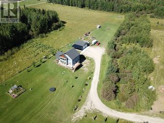 Photo 1: Custom built home with walk out basement and garage on 8.9 acres just north of Edson