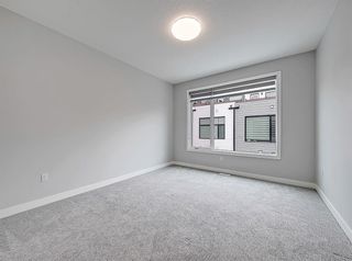 Photo 14: 107 408 27 Avenue NE in Calgary: Winston Heights/Mountview Row/Townhouse for sale : MLS®# A1207712