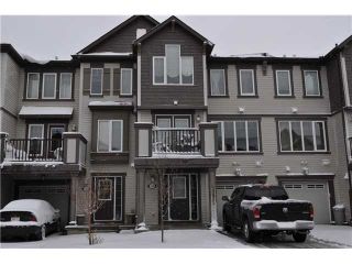 Photo 1: 118 WINDSTONE Crescent SW: Airdrie Townhouse for sale : MLS®# C3590682
