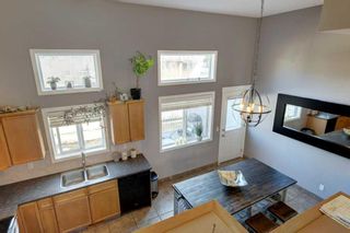 Photo 9: 48 Crystal Shores Cove: Okotoks Row/Townhouse for sale : MLS®# A2123368