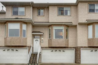 Photo 1: 128 Country Hills Gardens NW in Calgary: Country Hills Row/Townhouse for sale : MLS®# A1157775