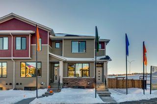 Photo 1: 7 Wolf Creek Drive SE in Calgary: C-281 Row/Townhouse for sale : MLS®# A2011697