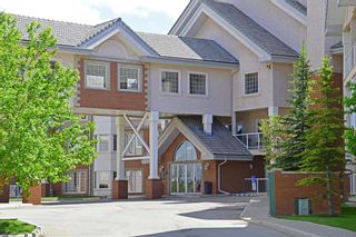 Photo 1: 220 223 Tuscany Springs Boulevard NW in Calgary: Tuscany Apartment for sale : MLS®# A1204040