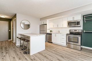 Photo 1: 406 1920 11 Avenue SW in Calgary: Sunalta Apartment for sale : MLS®# A1218364