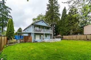 Photo 1: 9049 148 Street in Surrey: Bear Creek Green Timbers House for sale : MLS®# R2616008