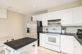 Photo 12: 591 Woodpark Boulevard SW in Calgary: Woodlands Detached for sale : MLS®# A2021172