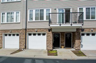 Photo 2: 37 13864 HYLAND Road in Surrey: East Newton Townhouse for sale in "TEO TOWNHOMES" : MLS®# R2674210