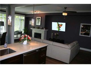 Photo 2: 105 3600 WINDCREST Drive in North Vancouver: Roche Point Townhouse for sale in "RAVEN WOODS" : MLS®# V1101013