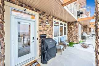 Photo 3: 4 145 Rockyledge View NW in Calgary: Rocky Ridge Row/Townhouse for sale : MLS®# A2018156