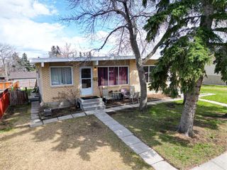 Photo 1: 7114 - 7116 Hunterville Road NW in Calgary: Huntington Hills Full Duplex for sale : MLS®# A2127434