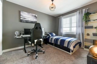 Photo 22: 11 West Coach Manor SW in Calgary: West Springs Row/Townhouse for sale : MLS®# A2035861