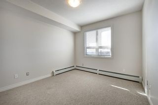 Photo 18: 415 26 Val Gardena View SW in Calgary: Springbank Hill Apartment for sale : MLS®# A1257390